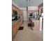 Kitchen featuring wood cabinets, stainless steel appliances, and tiled flooring for easy maintenance at 6009 Arbor Crest St, North Las Vegas, NV 89081