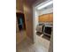 Laundry room featuring modern washer and dryer with built-in cabinets at 6009 Arbor Crest St, North Las Vegas, NV 89081