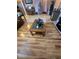 Open-concept living space with a wood floor, connecting to other areas of the house, and showcasing a piano at 6009 Arbor Crest St, North Las Vegas, NV 89081