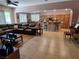 Spacious living room open to the kitchen, featuring tile flooring and comfortable seating at 6009 Arbor Crest St, North Las Vegas, NV 89081