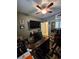 Picture of office space with ceiling fan, monitor, and pictures on the wall at 6009 Arbor Crest St, North Las Vegas, NV 89081