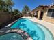Sparkling pool featuring a built-in hot tub and easy access from the main house at 6009 Arbor Crest St, North Las Vegas, NV 89081