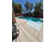 Clean pool featuring a spa and concrete tiling surrounding the exterior at 6009 Arbor Crest St, North Las Vegas, NV 89081