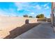 Large fenced backyard with a concrete patio and outdoor grill at 6224 Mandarin Dr, Las Vegas, NV 89108
