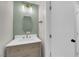 Updated powder room featuring a modern vanity and a decorative mirror at 638 Ribbon Grass Ave, Las Vegas, NV 89183