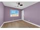 Bedroom featuring a ceiling fan, window, and wood-look flooring at 638 Ribbon Grass Ave, Las Vegas, NV 89183
