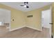 Bedroom featuring a ceiling fan and connecting doors at 638 Ribbon Grass Ave, Las Vegas, NV 89183