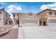 Attractive two-story stucco home with landscaped front yard and two-car garage at 638 Ribbon Grass Ave, Las Vegas, NV 89183