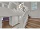 Staircase featuring a modern chandelier and a light-filled entry way at 638 Ribbon Grass Ave, Las Vegas, NV 89183
