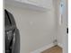 Laundry area with modern washer and white upper cabinets at 638 Ribbon Grass Ave, Las Vegas, NV 89183