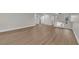 Open living room featuring modern wood-look floors and access to additional rooms at 638 Ribbon Grass Ave, Las Vegas, NV 89183