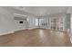Open living space with wood-look floors and natural light from large windows at 638 Ribbon Grass Ave, Las Vegas, NV 89183