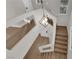 Bright staircase featuring modern lighting and wood-look steps at 638 Ribbon Grass Ave, Las Vegas, NV 89183