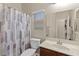 Functional bathroom featuring a combined shower and tub, toilet, and a vanity sink at 6413 White Tiger Ct, Las Vegas, NV 89130