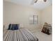 Comfortable bedroom featuring a vaulted ceiling and a collection of guitars adding character to the space at 6413 White Tiger Ct, Las Vegas, NV 89130