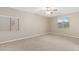 Bright, airy bedroom with ample space and natural light from two large windows at 6413 White Tiger Ct, Las Vegas, NV 89130