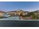 Charming single-story home with a three-car garage, desert landscaping, and appealing curb appeal at 6413 White Tiger Ct, Las Vegas, NV 89130