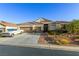 Charming single-story home with a three-car garage and well-maintained desert landscaping at 6413 White Tiger Ct, Las Vegas, NV 89130