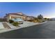 Beautiful house featuring desert landscaping, a three-car garage, and inviting curb appeal on a quiet street at 6413 White Tiger Ct, Las Vegas, NV 89130