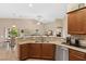 Open-concept kitchen featuring granite countertops, stainless steel appliances, and seamless flow into the living area at 6413 White Tiger Ct, Las Vegas, NV 89130