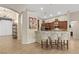 Stylish kitchen with dark wood cabinets, stainless steel appliances, and granite countertops at 6413 White Tiger Ct, Las Vegas, NV 89130