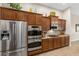 Modern kitchen boasts stainless steel appliances, custom cabinetry, and a functional layout for cooking at 6413 White Tiger Ct, Las Vegas, NV 89130