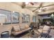Cozy covered patio area with comfortable seating and a view to the backyard, ideal for outdoor lounging at 6413 White Tiger Ct, Las Vegas, NV 89130