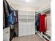 Spacious walk-in closet with custom shelving for storage and organization at 6413 White Tiger Ct, Las Vegas, NV 89130