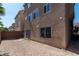 View of the property's empty and spacious backyard area with block wall and rear elevation at 6705 Philharmonic Ave, Las Vegas, NV 89139
