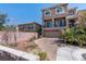Charming two-story home with brick paved driveway and desert landscaping at 6705 Philharmonic Ave, Las Vegas, NV 89139