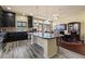 Open concept kitchen with large island and eating area at 6705 Philharmonic Ave, Las Vegas, NV 89139