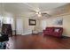 Comfortable living room featuring hardwood floors and neutral colored walls at 6705 Philharmonic Ave, Las Vegas, NV 89139