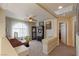 Bright loft space with neutral carpeting, a desk area, and a ceiling fan at 6705 Philharmonic Ave, Las Vegas, NV 89139