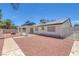 Backyard featuring low maintenance landscaping and a firepit at 6808 Waterhen Cir, Las Vegas, NV 89108