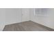 Bedroom featuring wood-look floors and a window for natural light at 6808 Waterhen Cir, Las Vegas, NV 89108