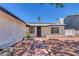 Attractive single-story home with desert landscaping, security bars on windows and a brick walkway at 6808 Waterhen Cir, Las Vegas, NV 89108