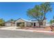 Inviting single-story home with desert landscaping, and a two-car garage at 6808 Waterhen Cir, Las Vegas, NV 89108