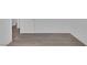 Hallway featuring wood-look flooring and white trim at 6808 Waterhen Cir, Las Vegas, NV 89108