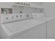 Well-lit laundry room with both washer and dryer at 6808 Waterhen Cir, Las Vegas, NV 89108