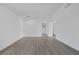 Spacious room with gray flooring, white walls, and multiple doorways at 6808 Waterhen Cir, Las Vegas, NV 89108