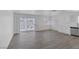 Open living room with sliding glass doors and hardwood floors, perfect for entertaining at 6808 Waterhen Cir, Las Vegas, NV 89108