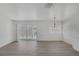 Spacious living room with modern lighting, windows and sliding doors at 6808 Waterhen Cir, Las Vegas, NV 89108