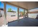 Covered back patio with a playground area, and decorative curtains, ideal for outdoor entertainment and relaxation at 7021 Salt Marsh Ct, Las Vegas, NV 89148
