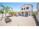 Spacious backyard featuring a covered patio, ' play area, and minimal landscaping, ideal for outdoor activities at 7021 Salt Marsh Ct, Las Vegas, NV 89148