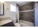 Bathroom featuring tiled shower-tub and a white sink at 7021 Salt Marsh Ct, Las Vegas, NV 89148