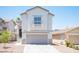 Inviting two-story home with a well-maintained front yard and a convenient two-car garage at 7021 Salt Marsh Ct, Las Vegas, NV 89148