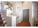 The front foyer has neutral walls and carpet and features a staircase and stylish coat rack at 7021 Salt Marsh Ct, Las Vegas, NV 89148