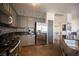 Stylish kitchen with stainless steel appliances, granite countertops, and tile backsplash at 7021 Salt Marsh Ct, Las Vegas, NV 89148