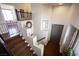 Stylish staircase with carpeted steps, art nooks, and natural light leading to a well-designed entryway at 7021 Salt Marsh Ct, Las Vegas, NV 89148