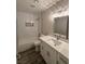 Bathroom with white subway tile, stylish vanity, and modern fixtures at 7144 Forest Vista St, Las Vegas, NV 89147
